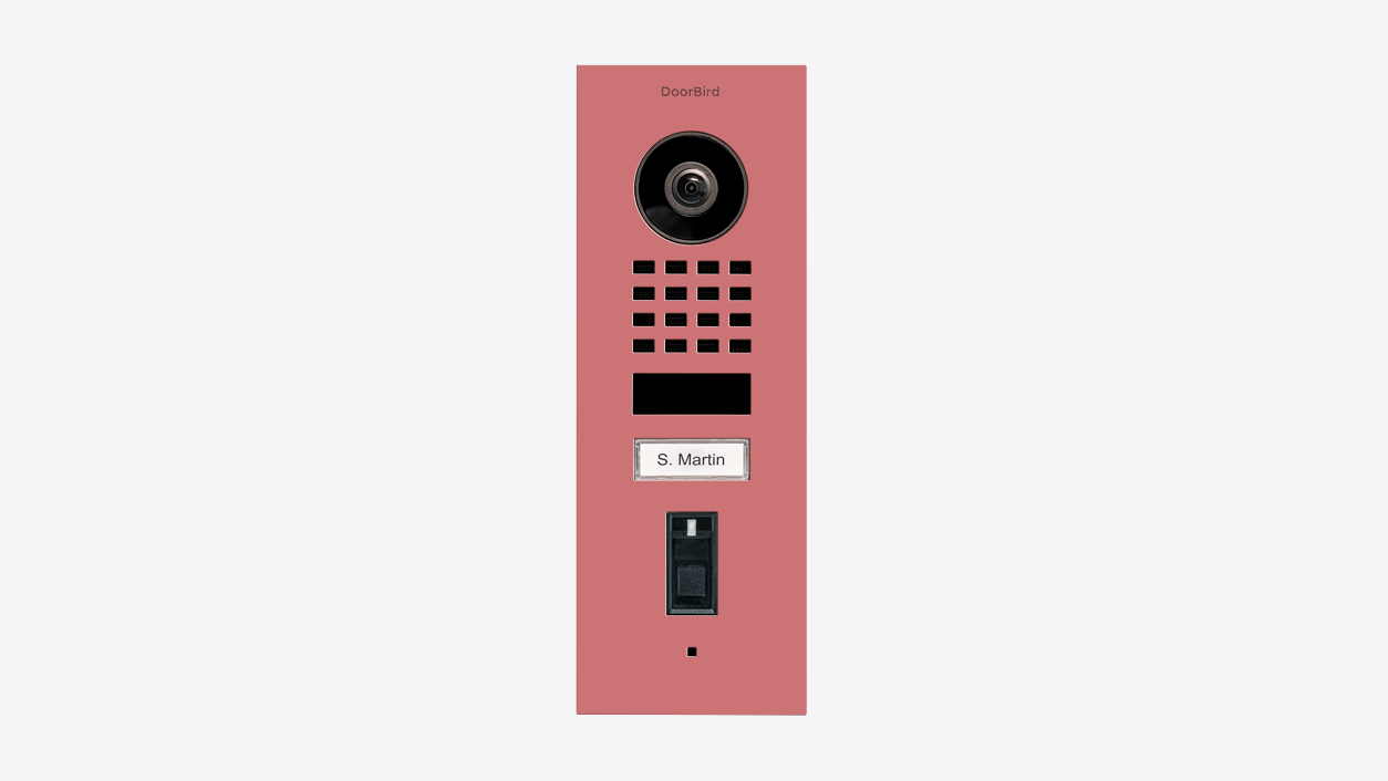 Antique pink flush-mount video door station with camera lens, speaker grille, and call button