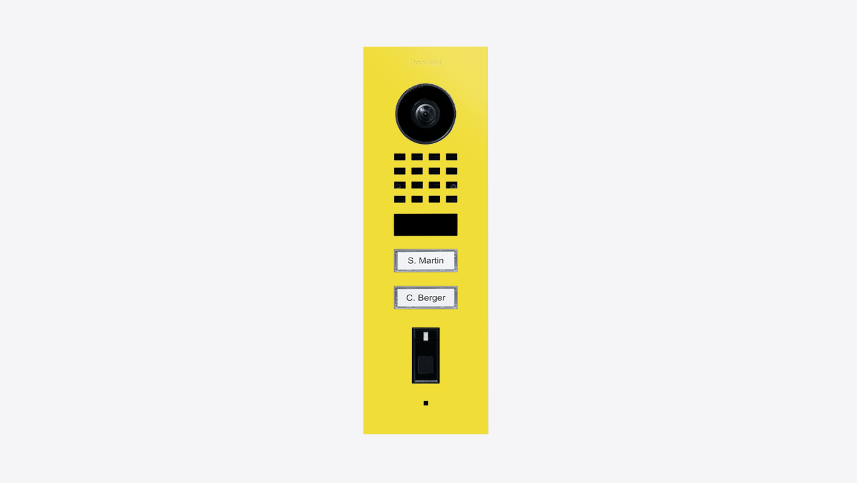 Yellow RAL 1016 video door station with camera, keypad grille, and nameplate slots
