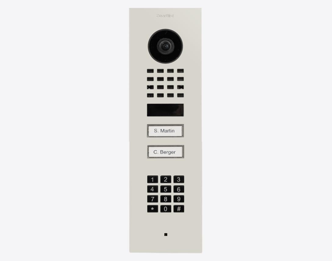 DoorBird flush-mount IP video door station in grey-white with camera lens and keypad