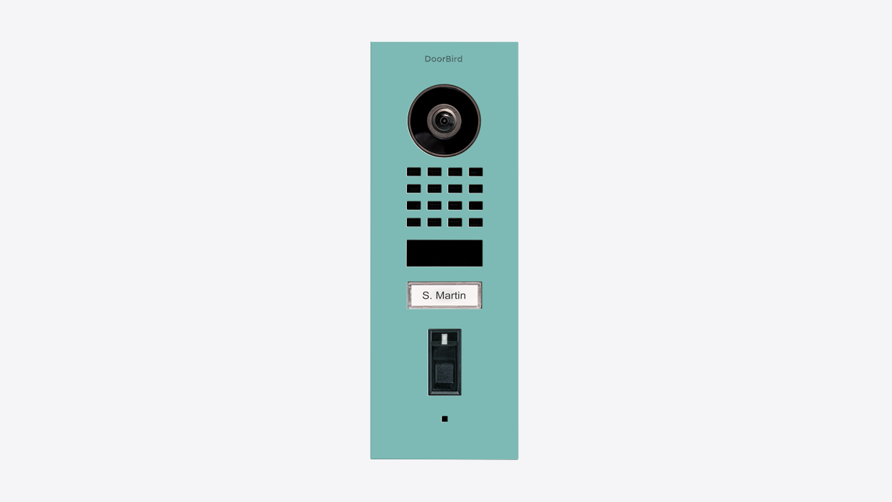 Front view DoorBird flush-mount video door station in light green with camera lens and call button