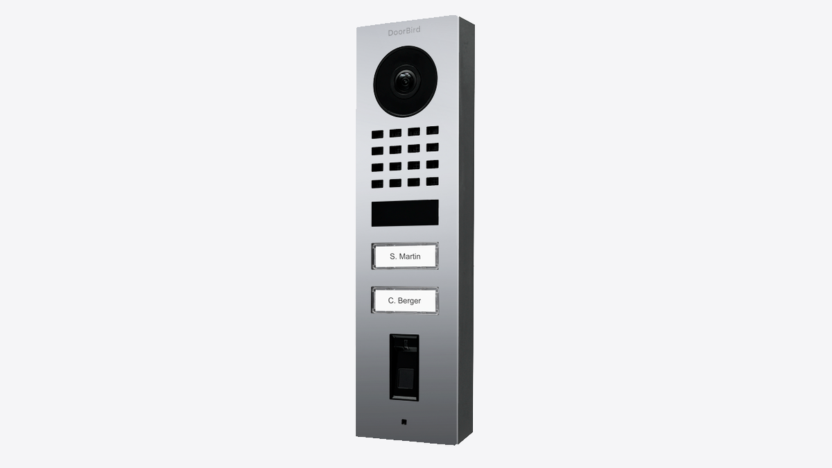 Chrome surface-mount IP video door station with camera, speaker grille, and name labels