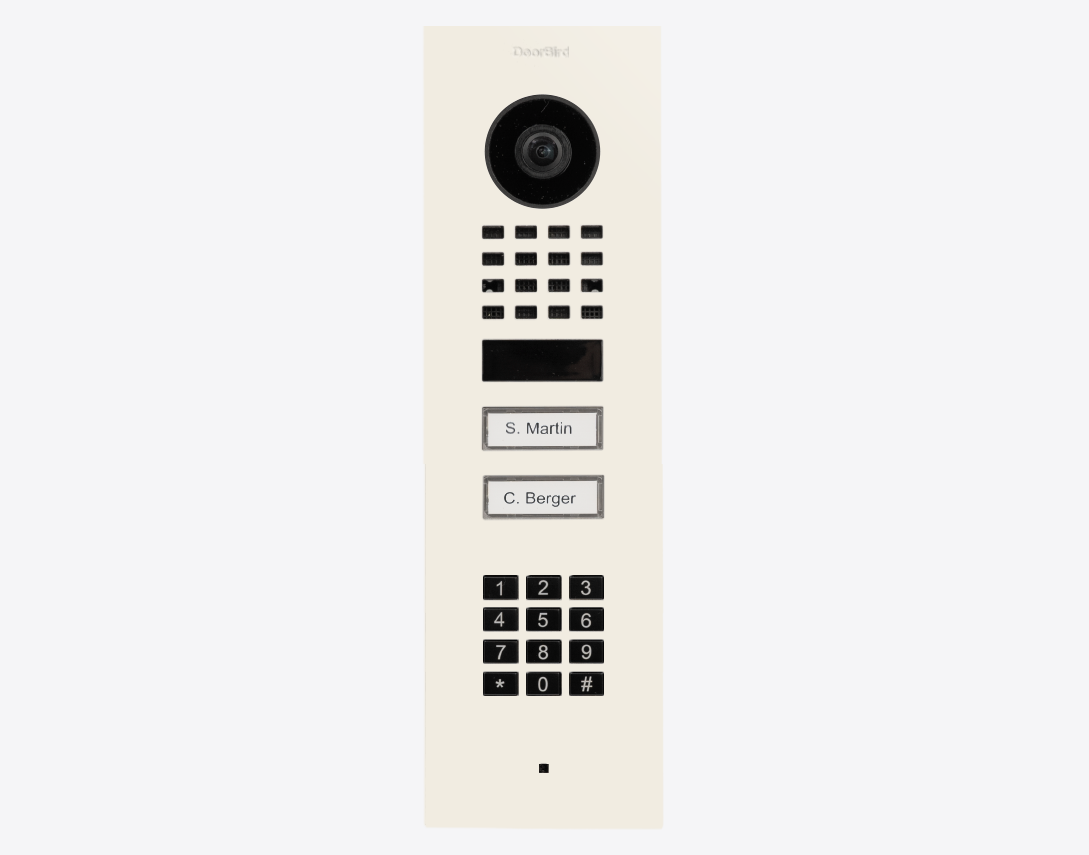 Flush-mount video door station in white with camera lens, numeric keypad, call buttons