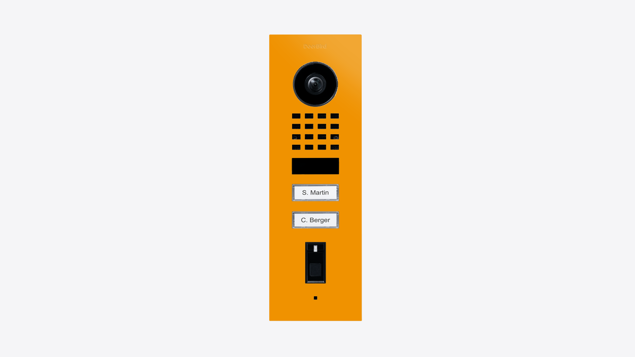 Sun yellow flush-mount video door station with camera lens, speaker grille, and call buttons