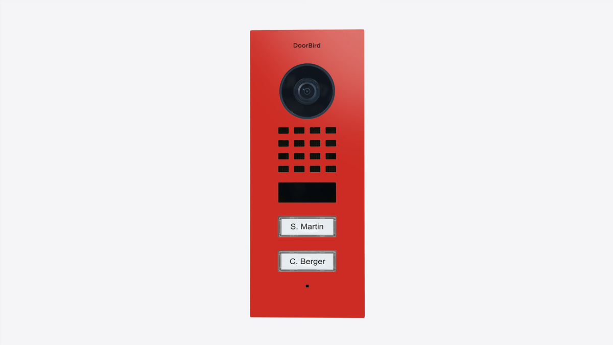 DoorBird flush-mount video door station with red housing, camera, grille, and two call buttons