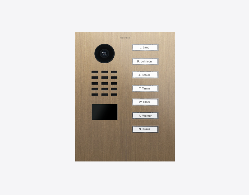 Burnished brass IP video door station with 7 call buttons and camera lens