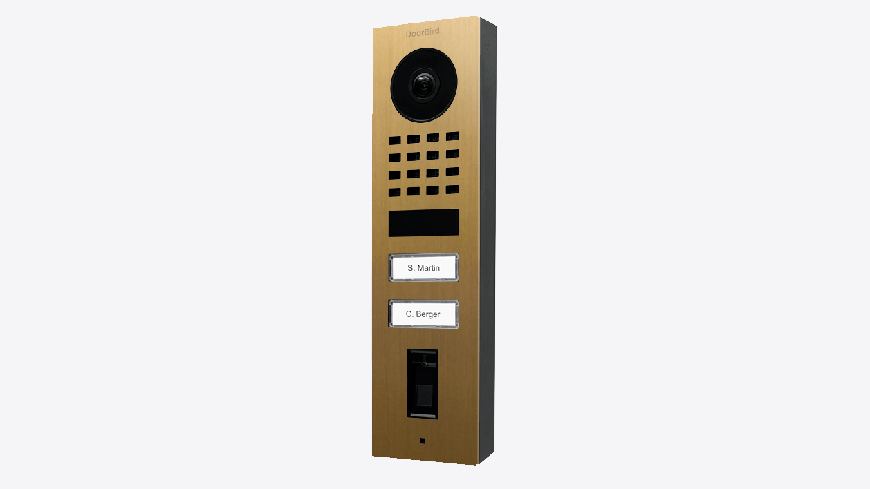 DoorBird D1102FV gold video door station with camera, keypad, and name labels