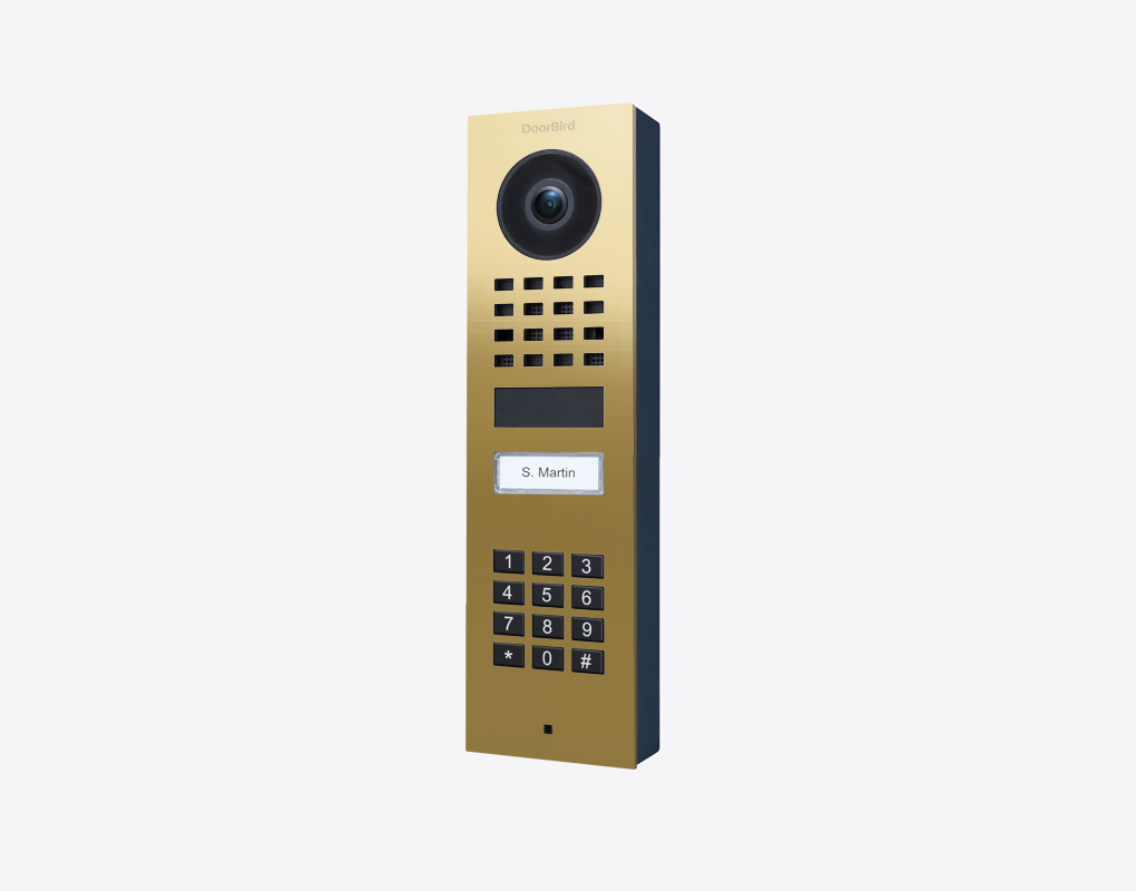 Brass surface-mount video door station with camera lens and numbered keypad panel