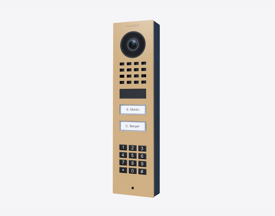DoorBird IP video door station in beige with camera, keypad, and two call buttons