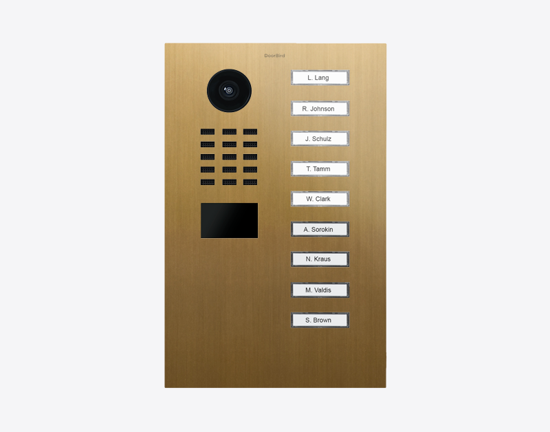 Gold video door station with camera lens and nine illuminated call buttons
