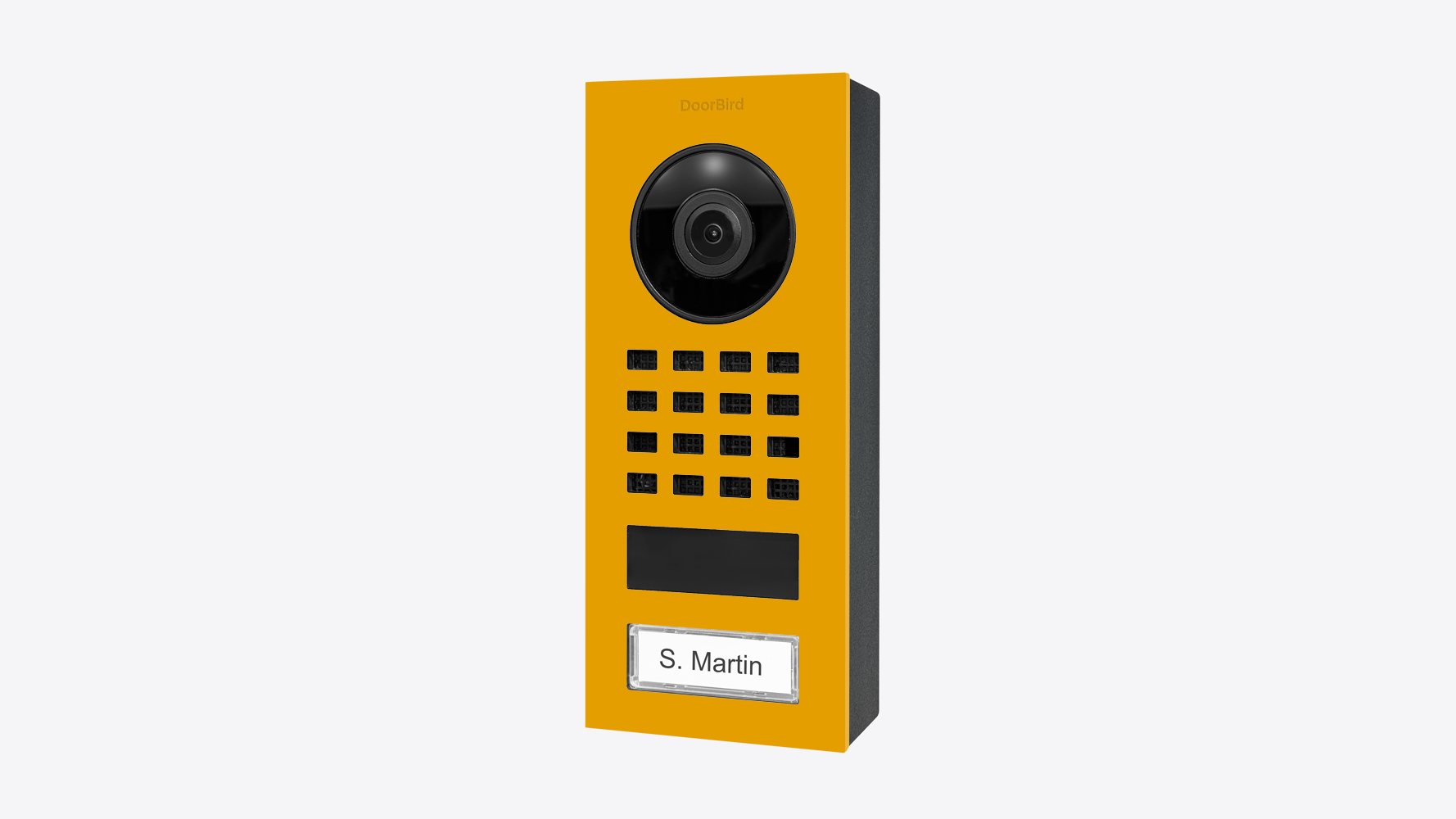 DoorBird surface-mount video intercom in golden yellow with camera lens and keypad