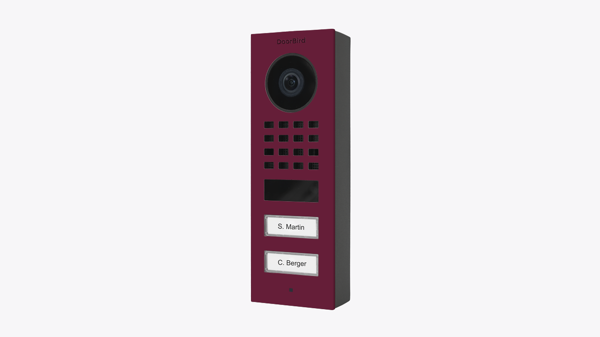 DoorBird surface-mount video door station in claret violet with camera and keypad