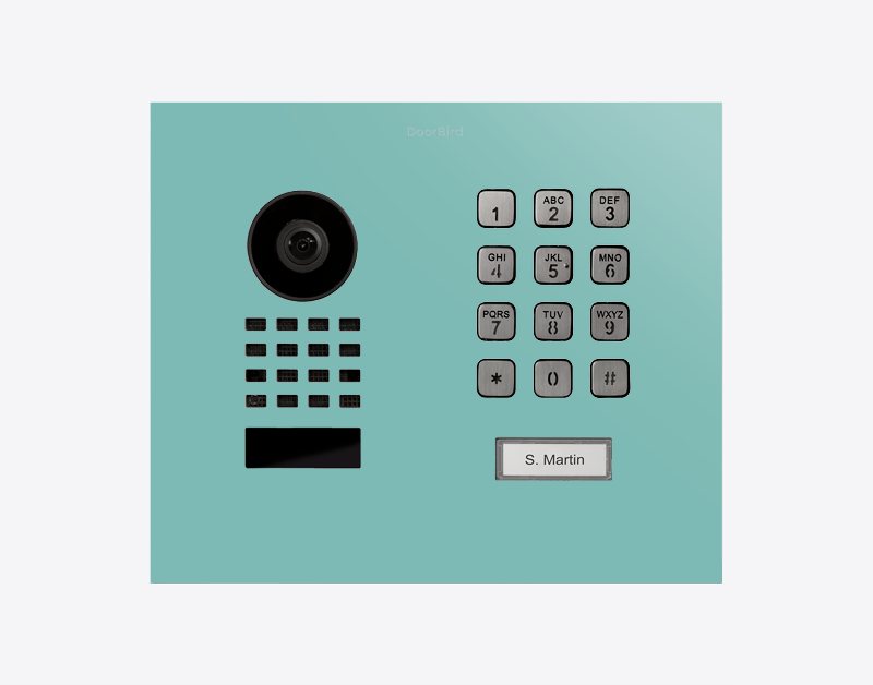 DoorBird video door station front in light green with keypad, camera, and nameplate