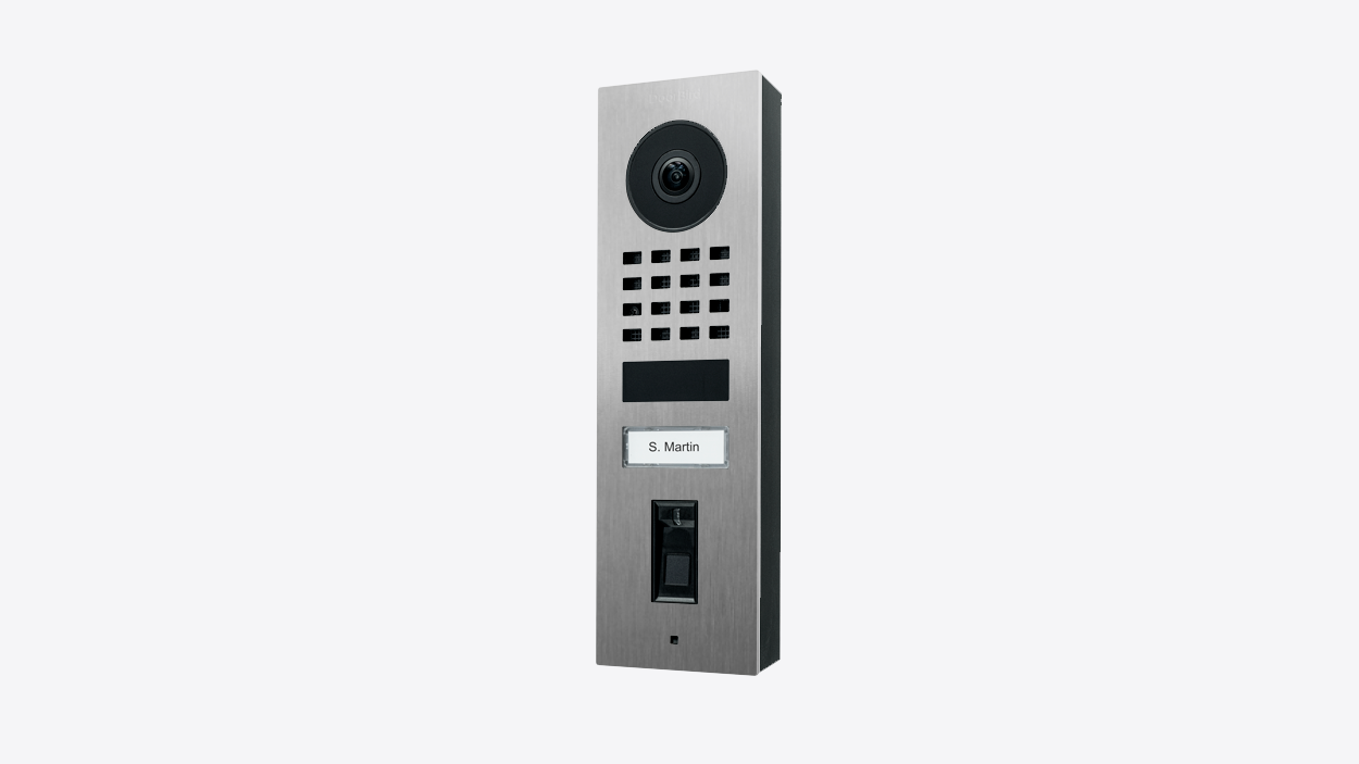 Stainless steel surface-mount video door station with camera and speaker grille