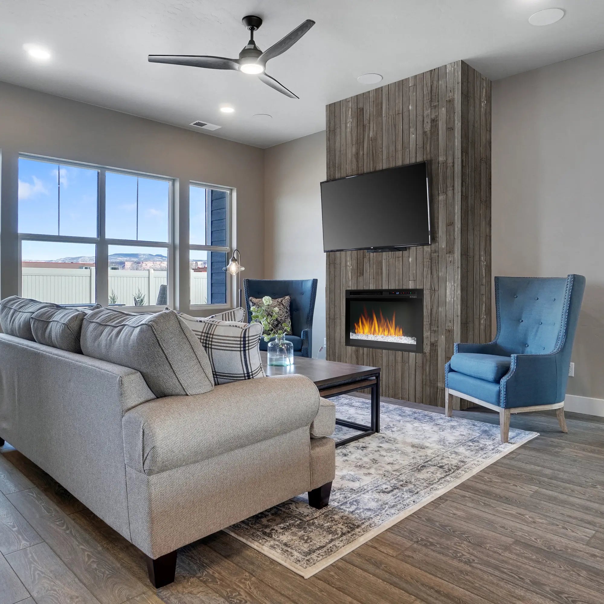 Black electric firebox installed in a modern living room wall with visible flame effect