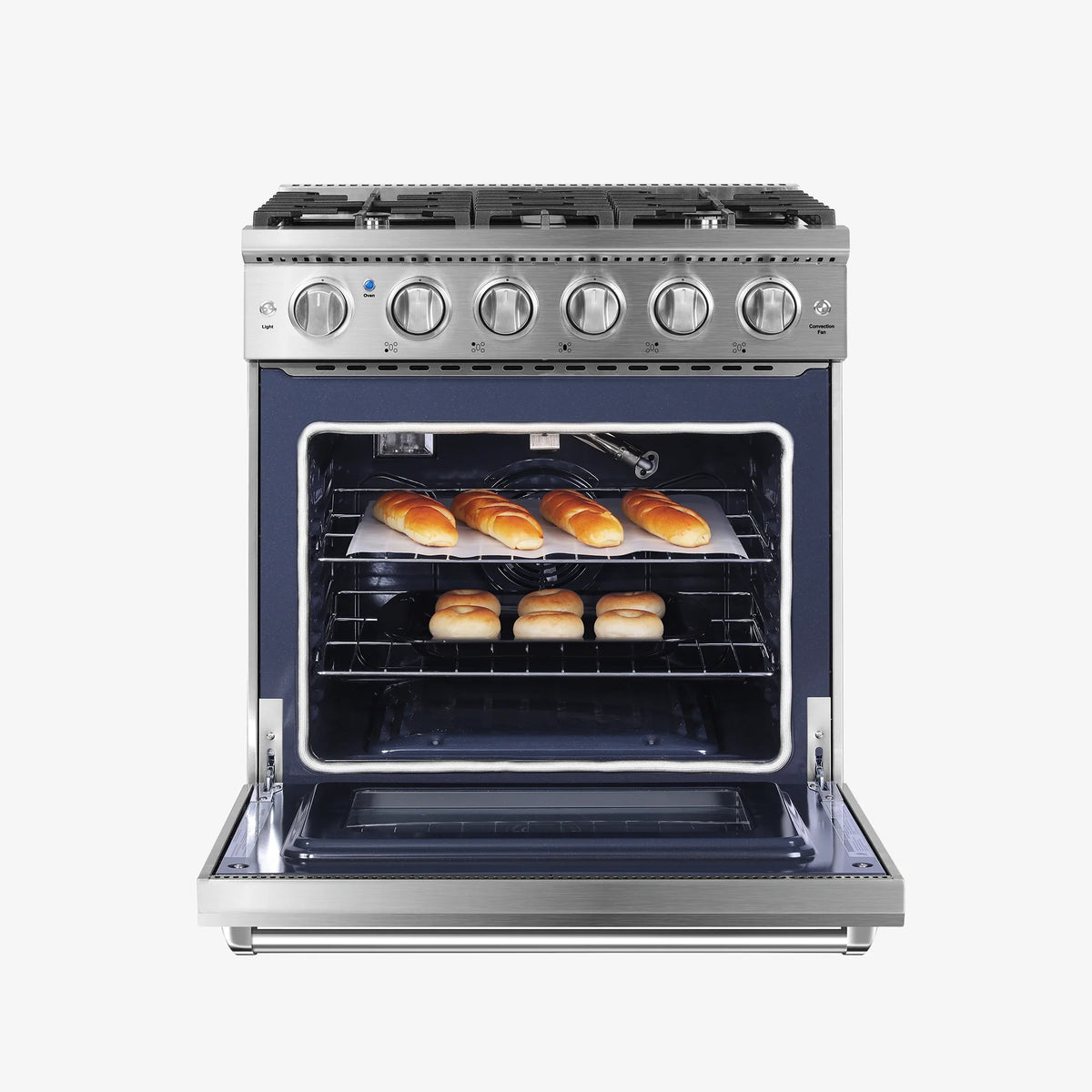 Stainless steel gas range with open oven door and baking trays with rolls