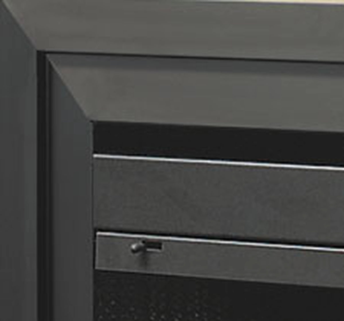 Close-up of black trim frame corner with small mounting hardware