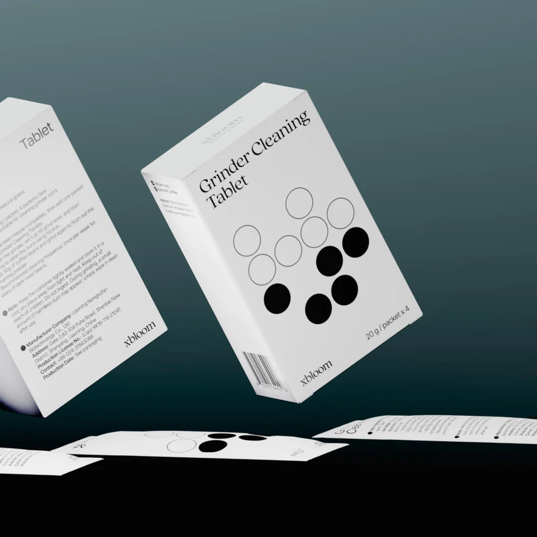 xBloom grinder cleaning tablet boxes, white cartons with circular icon and directions
