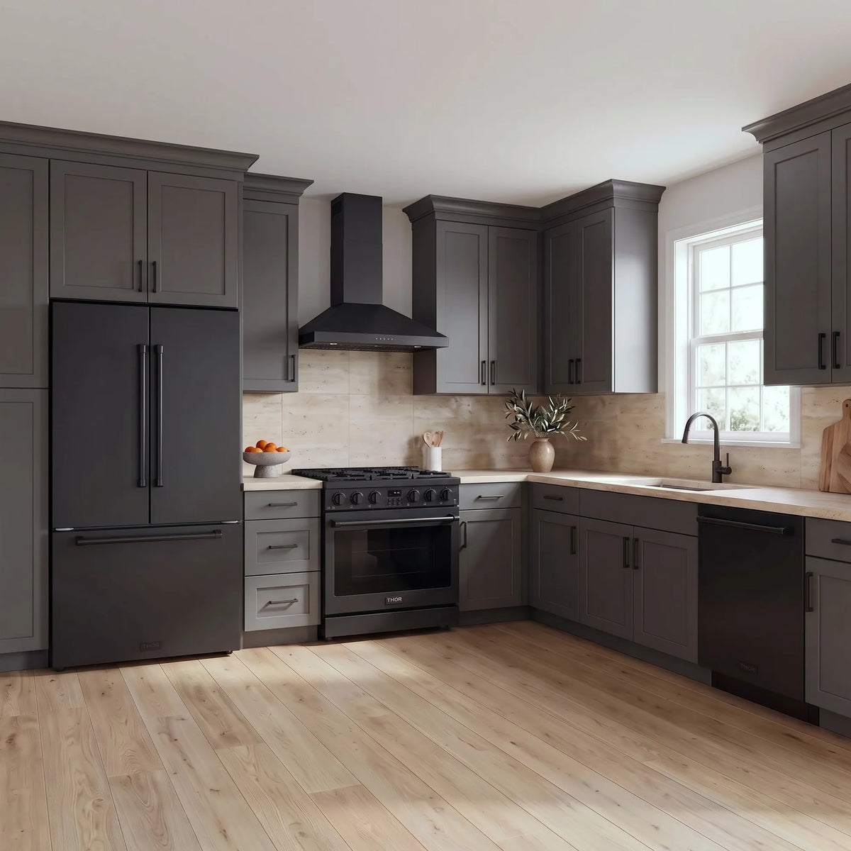 Thor Kitchen A-Series black kitchen with a 36-inch gas range, wall-mount chimney hood, French door refrigerator, dishwasher