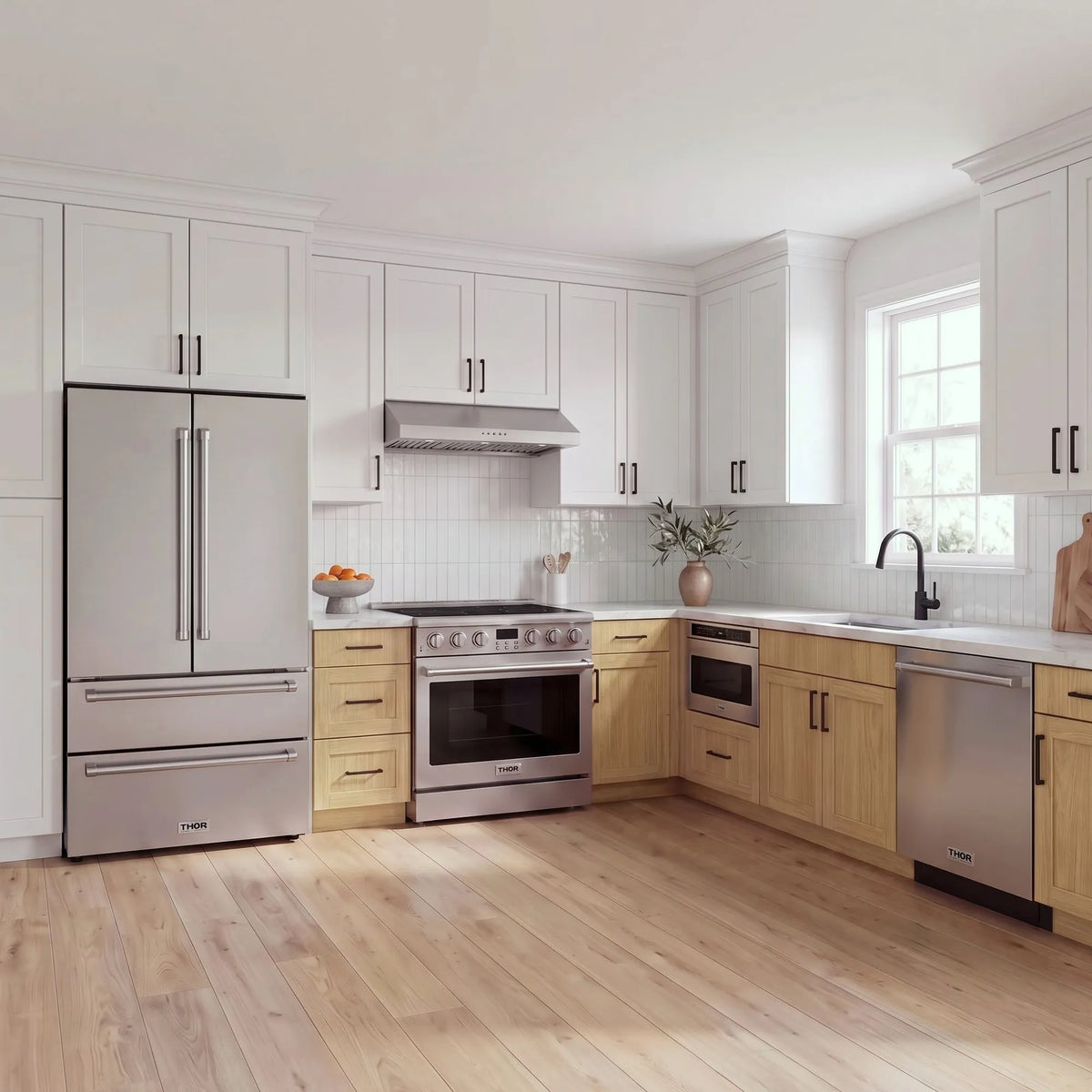 Thor Kitchen A-Series stainless steel kitchen with a 36-inch electric range, under-cabinet hood, French door refrigerator, dishwasher and microwave drawer