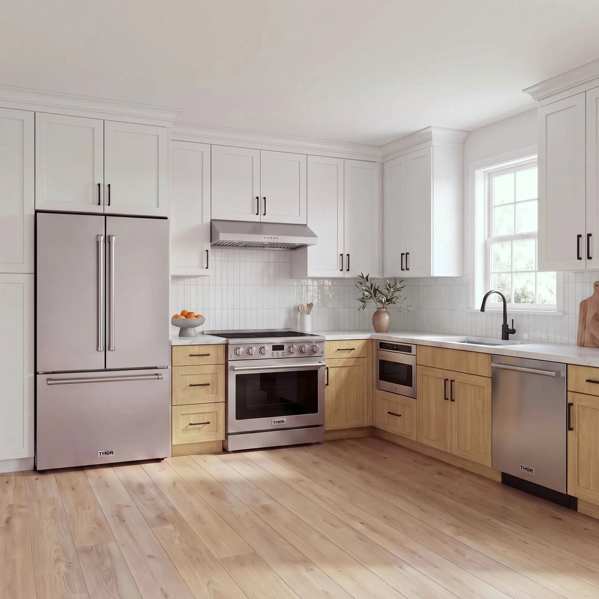 Thor Kitchen A-Series stainless steel kitchen with a 36-inch electric range, under-cabinet hood, French door refrigerator, dishwasher and microwave drawer