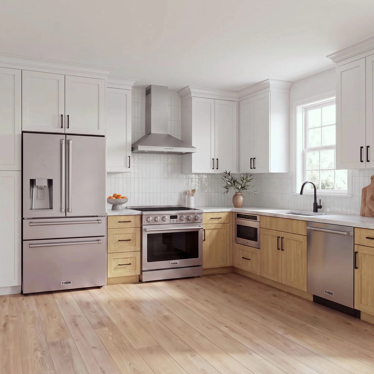 Thor Kitchen A-Series stainless steel kitchen with a 36-inch electric range, wall-mount chimney hood, French door refrigerator, dishwasher and microwave drawer