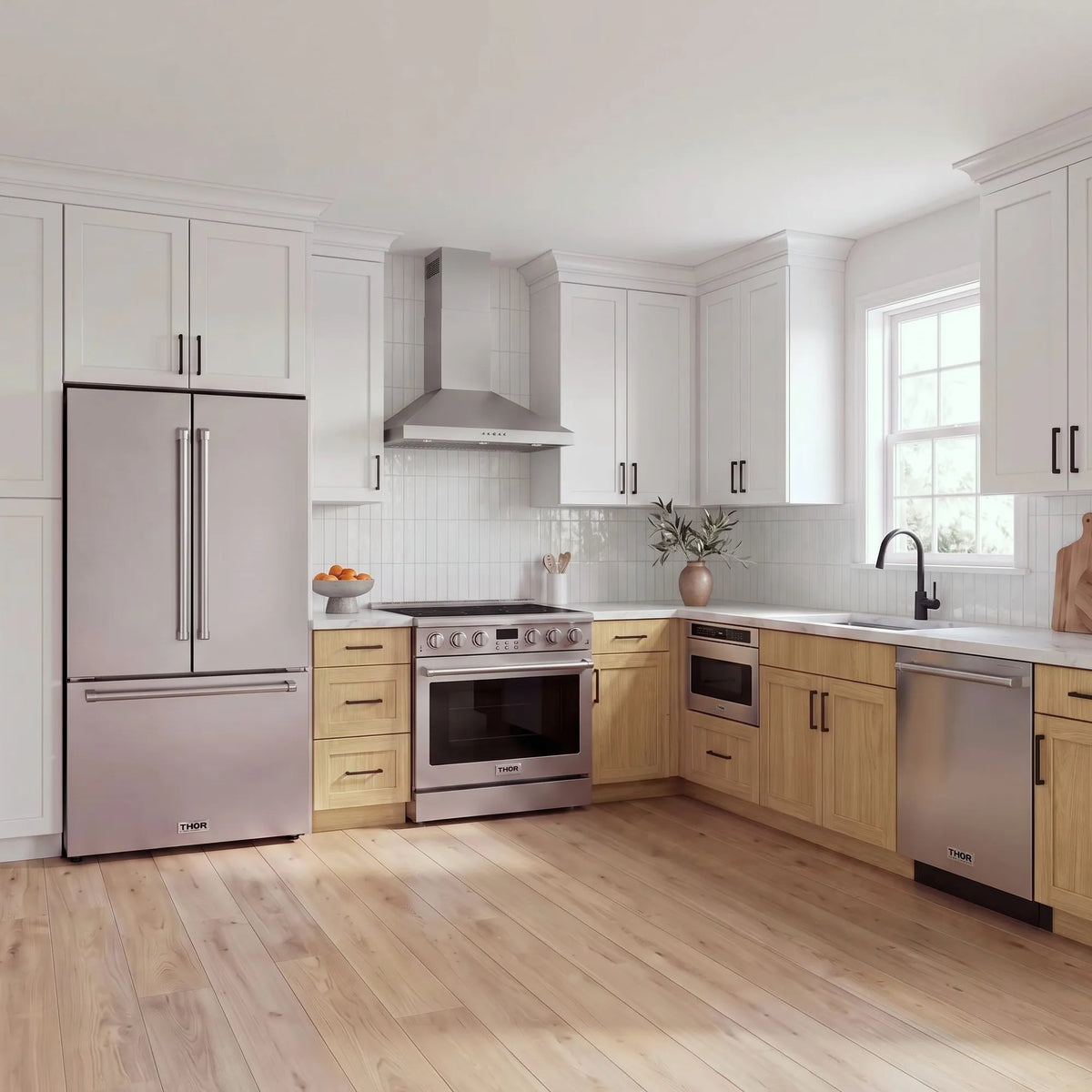 Thor Kitchen A-Series stainless steel kitchen with a 36-inch electric range, wall-mount chimney hood, French door refrigerator, dishwasher and microwave drawer