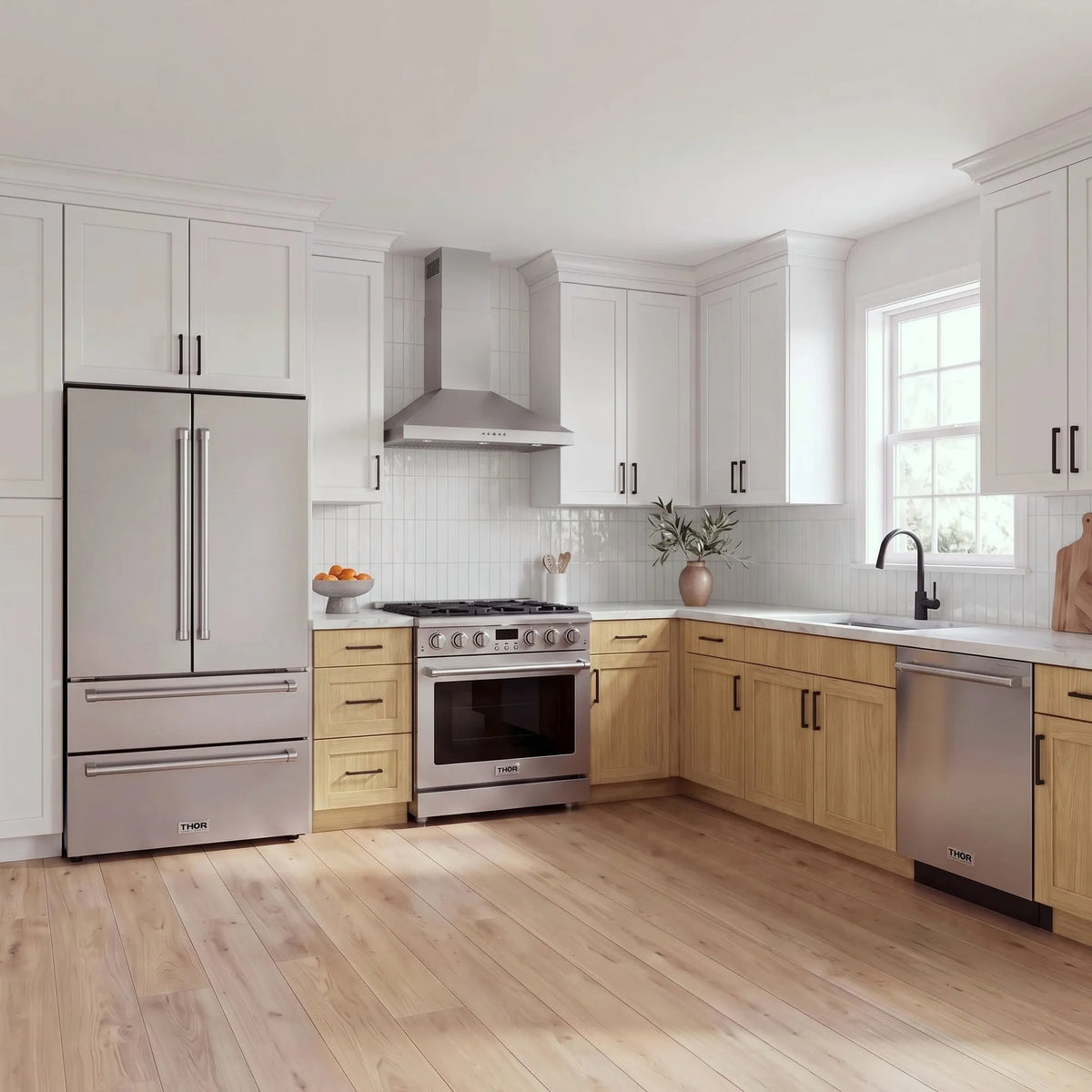 Thor Kitchen A-Series stainless steel kitchen with a 36-inch gas range, wall-mount chimney hood, French door refrigerator, dishwasher