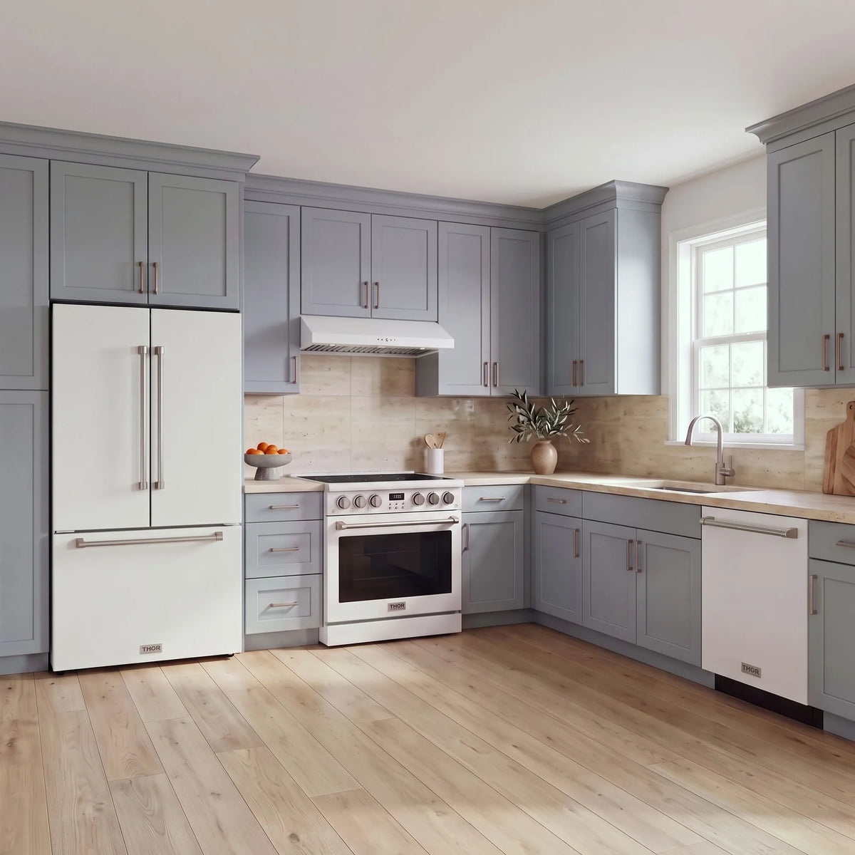 Thor Kitchen A-Series white kitchen with a 36-inch electric range, under-cabinet hood, French door refrigerator, dishwasher