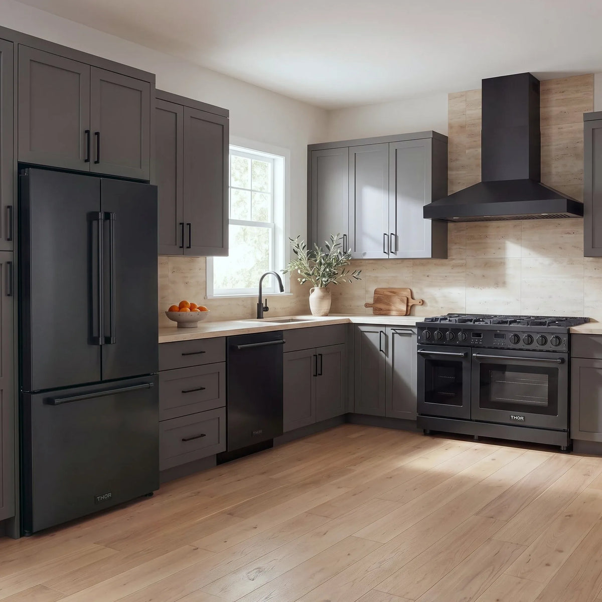 Thor Kitchen A-Series black kitchen with a 48-inch gas range, wall-mount chimney hood, French door refrigerator, dishwasher