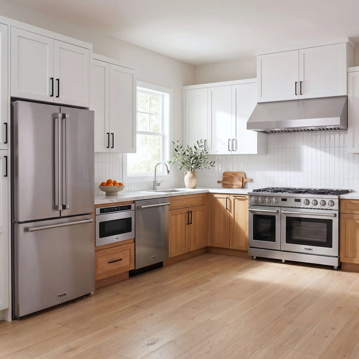 Thor Kitchen A-Series stainless steel kitchen with a 48-inch gas range, under-cabinet hood, French door refrigerator, dishwasher and microwave drawer