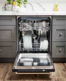 Open built-in dishwasher showing upper and lower racks with dishware
