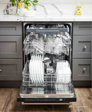 Built-in dishwasher with open door and silver racks, showing the wash interior.