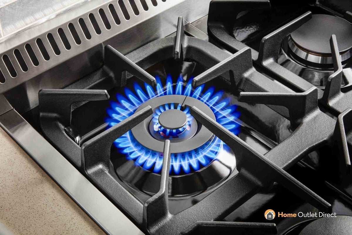 Propane gas cooktop burner with blue flame and black burner grates