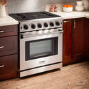 Stainless steel gas range in kitchen setting with six burners and oven door window