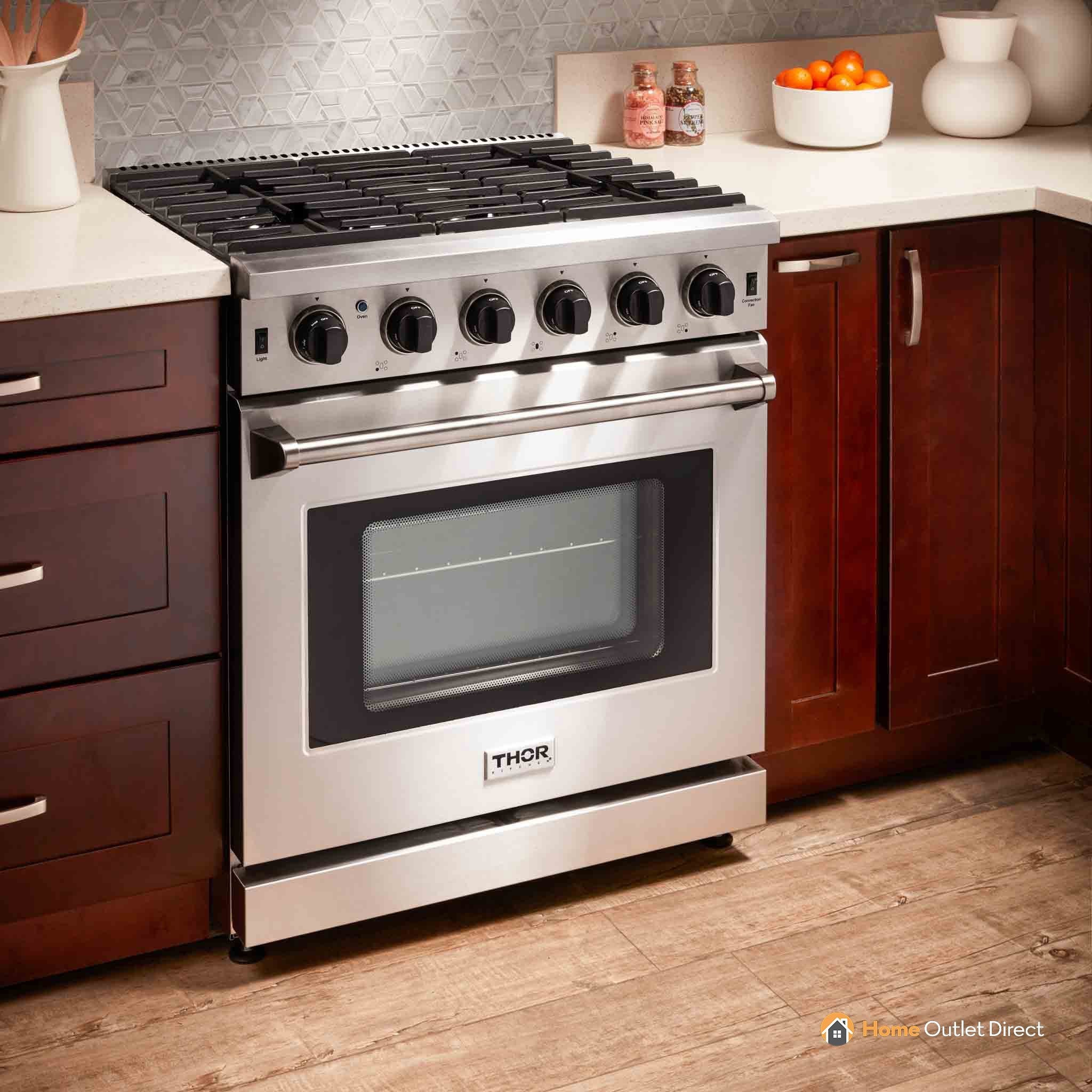 Stainless steel gas range in kitchen setting with six burners and oven door window