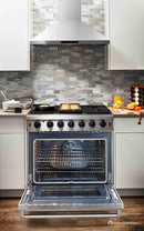 Stainless steel gas range with open oven and storage drawer below the door