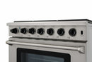 Stainless steel cooktop control panel with six black knobs and burner rail