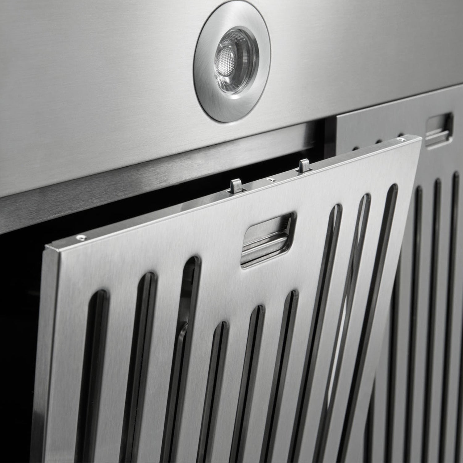 Stainless steel range hood pull-out panel with vented grille