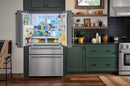 Stainless steel French door refrigerator with open doors and organized interior shelves