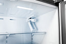 Refrigerator interior with overhead light, fan vent, and adjustable upper shelf