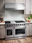 Stainless steel double oven gas range with overhead vent hood and two oven doors