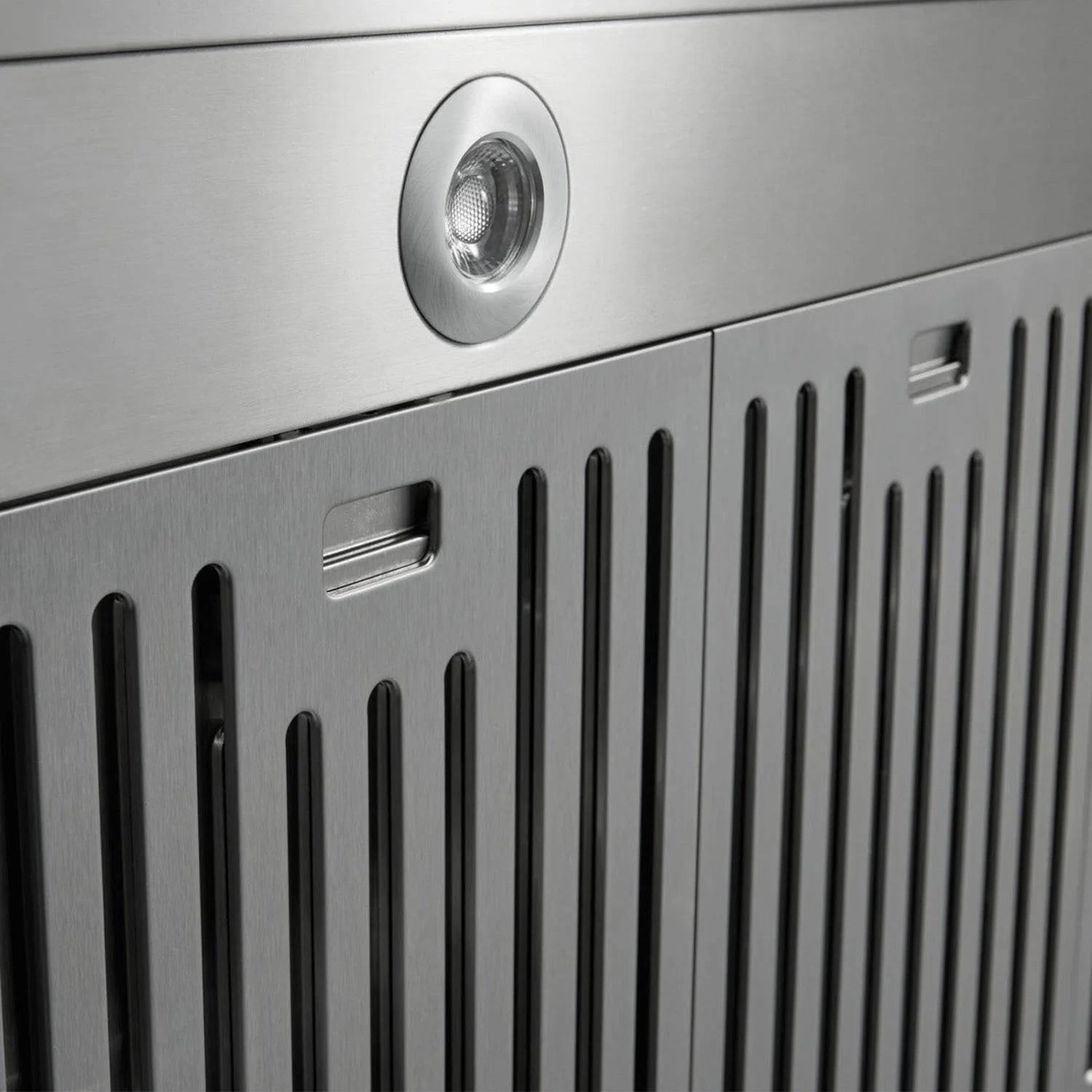 Stainless steel range hood vent panel with circular light and grille