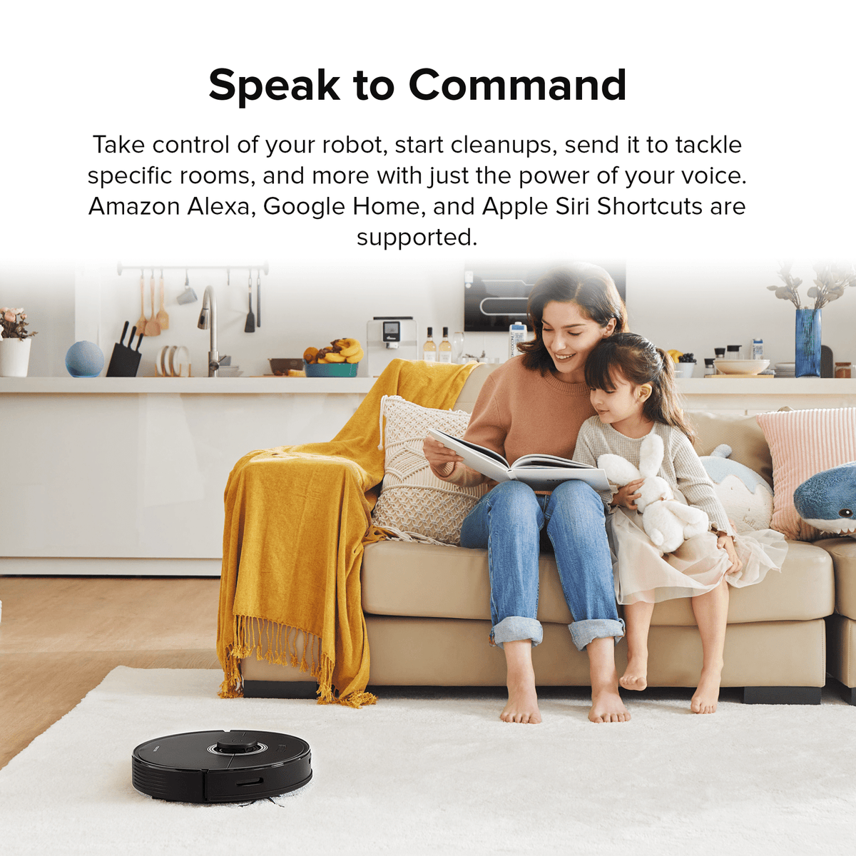 Black Roborock robot vacuum and mop on floor near sofa