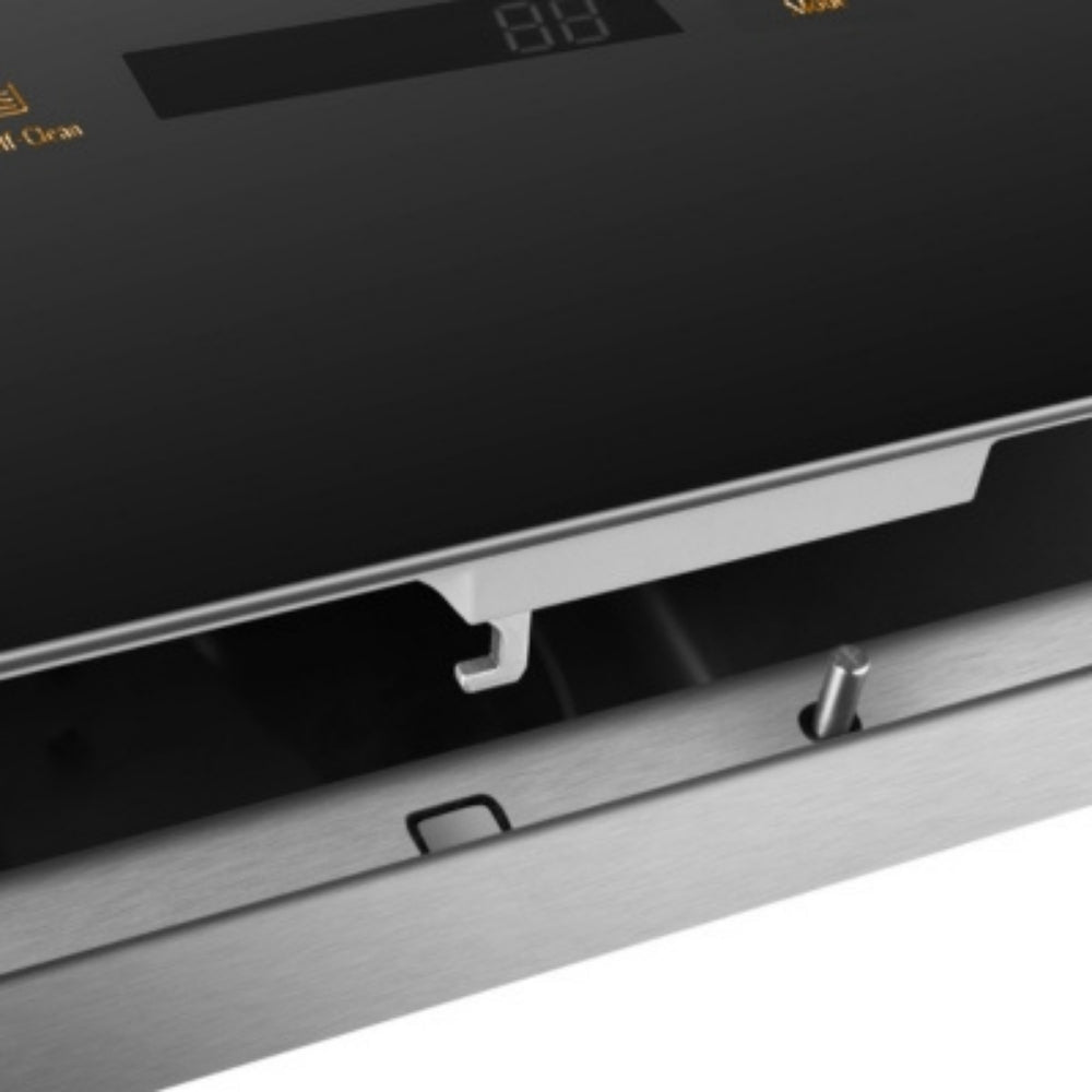 Stainless in-sink dishwasher front panel with recessed handle and trim, close-up