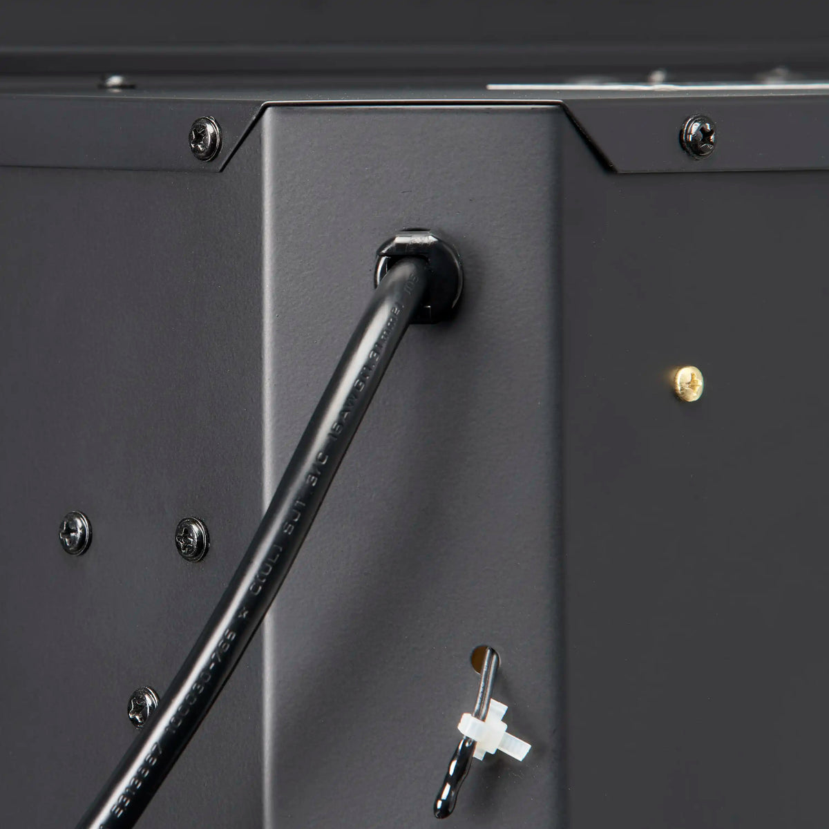 Black electric firebox latch handle and mounting hardware close-up