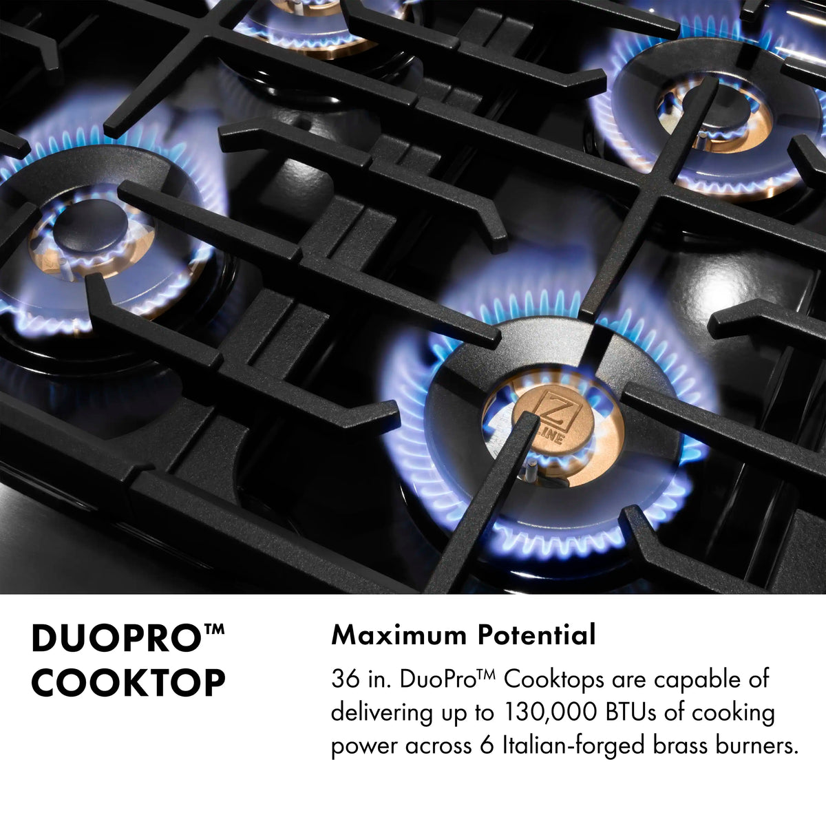 Stainless gas cooktop with black grates and bronze burner caps, lit flames visible