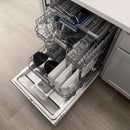 Dishwasher door open showing lower rack, utensil basket, and stainless tub