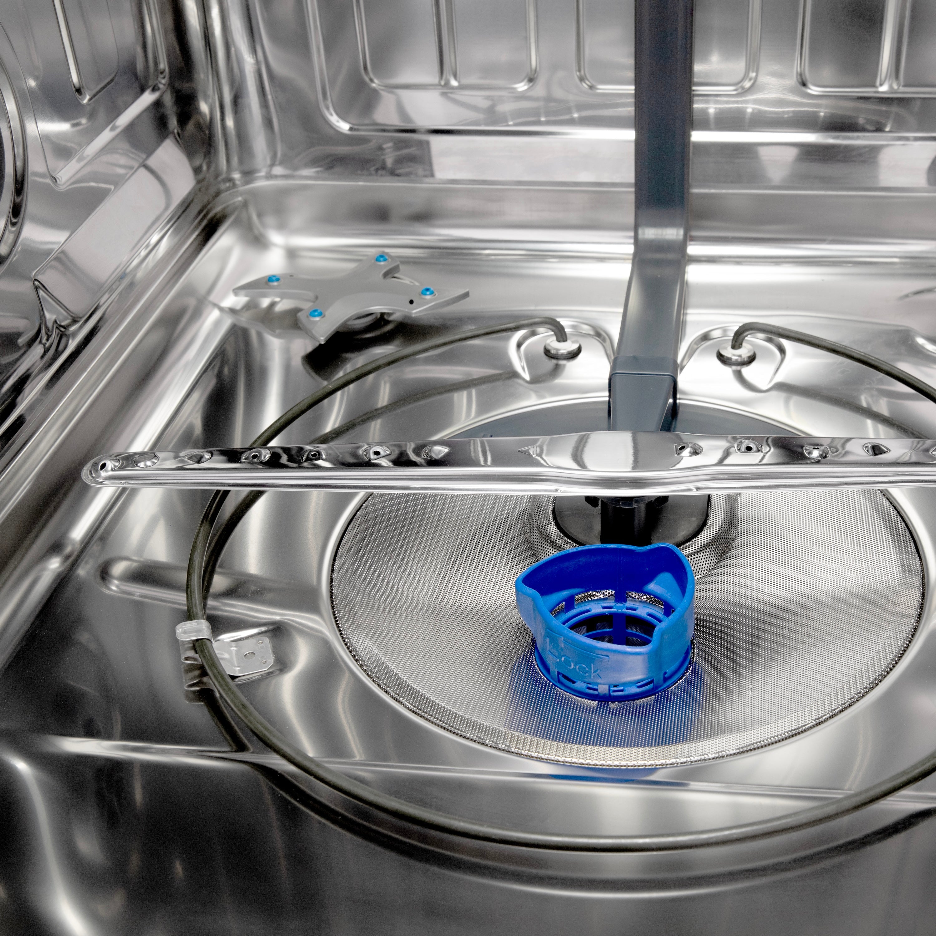 Stainless steel dishwasher wash area with circular spray cover and blue rinse cup