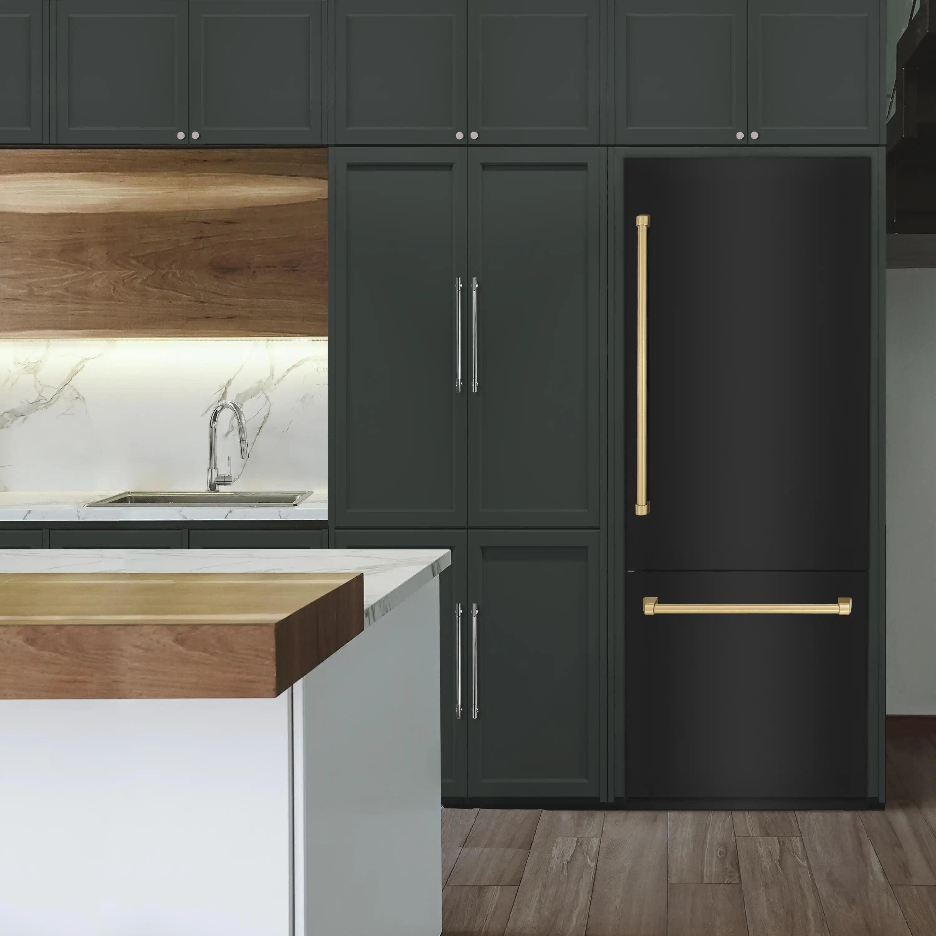 Black stainless bottom freezer refrigerator with champagne bronze handles in a kitchen