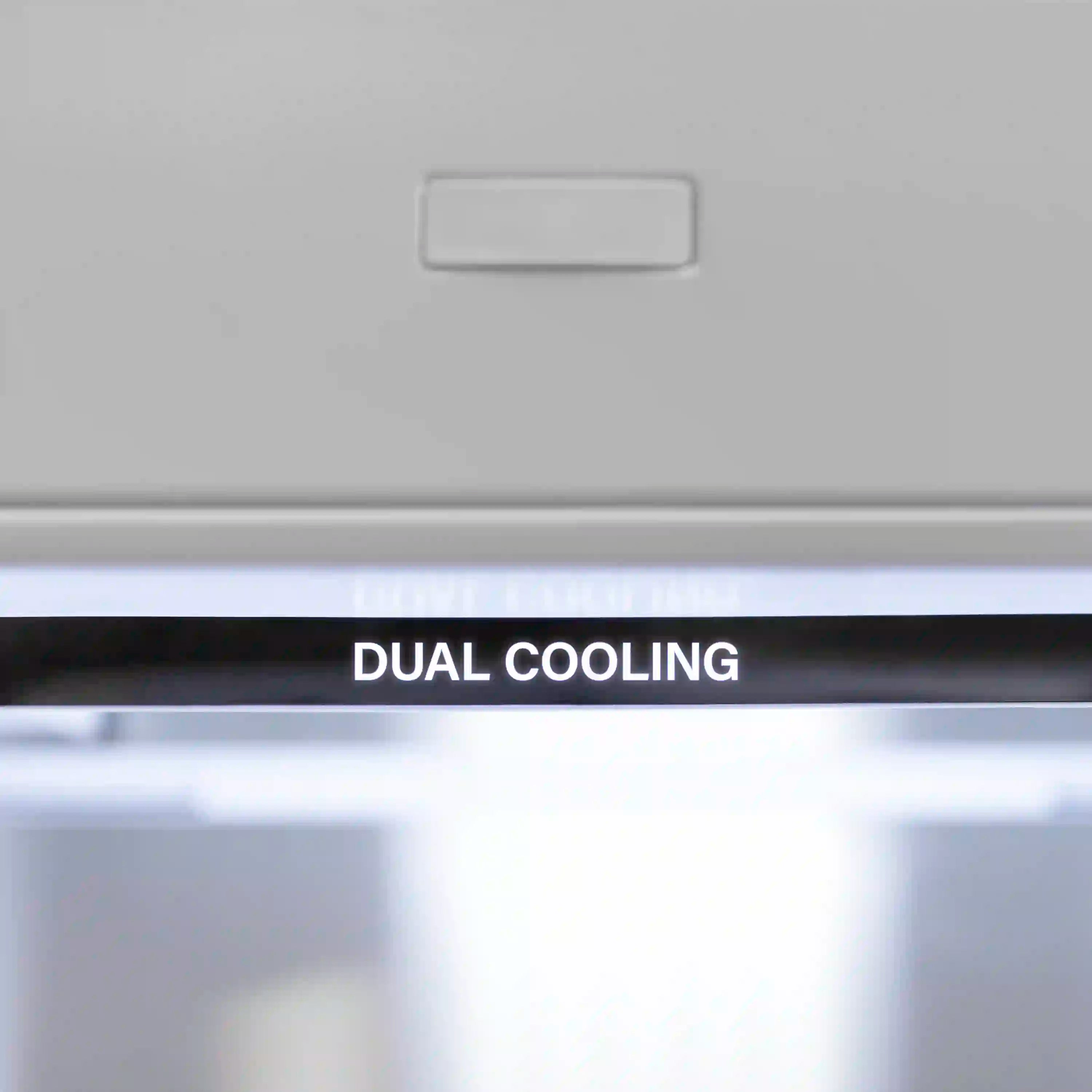 Stainless steel refrigerator with visible text panel for dual cooling